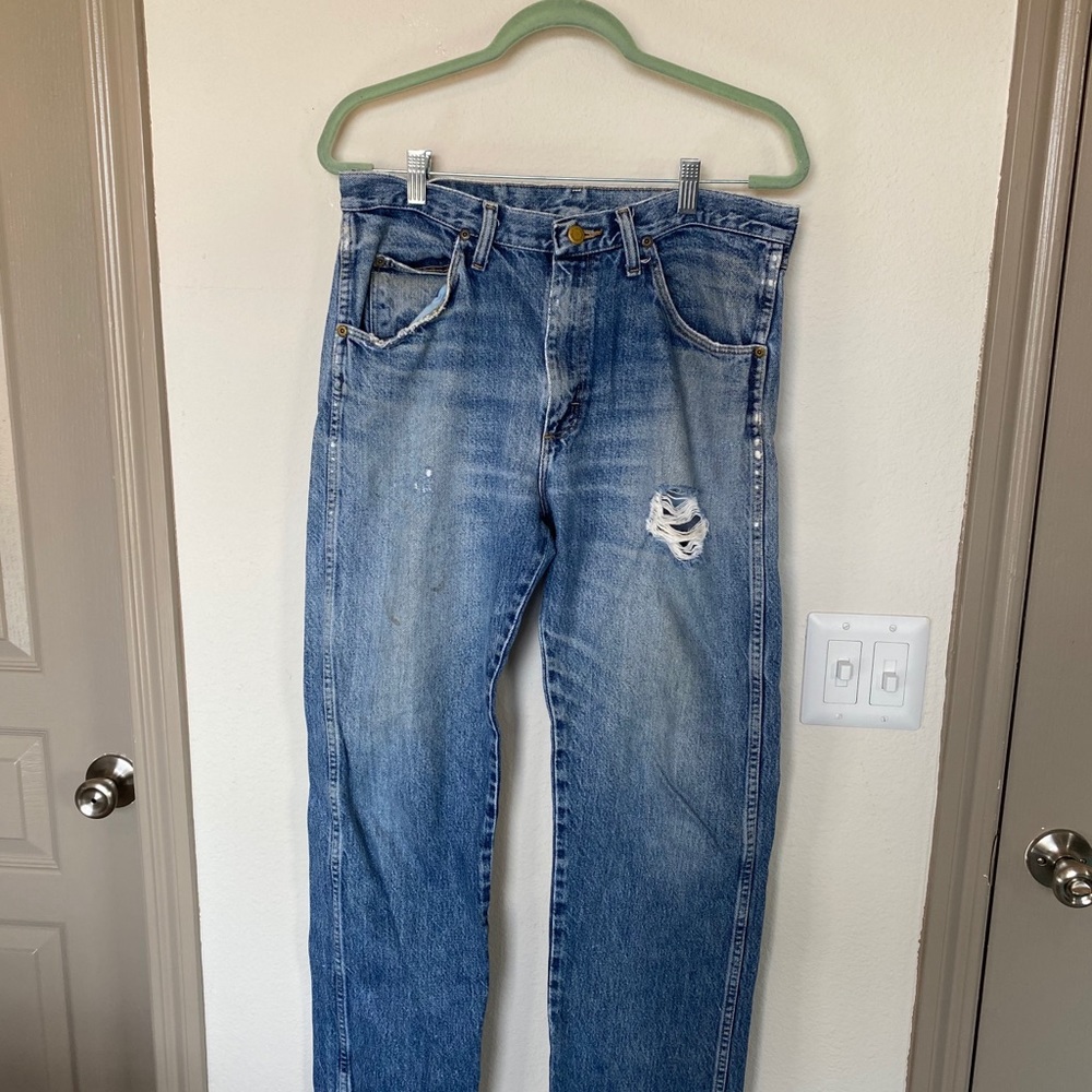 33x32 worn in cowboy Wranglers. Wear and tear.